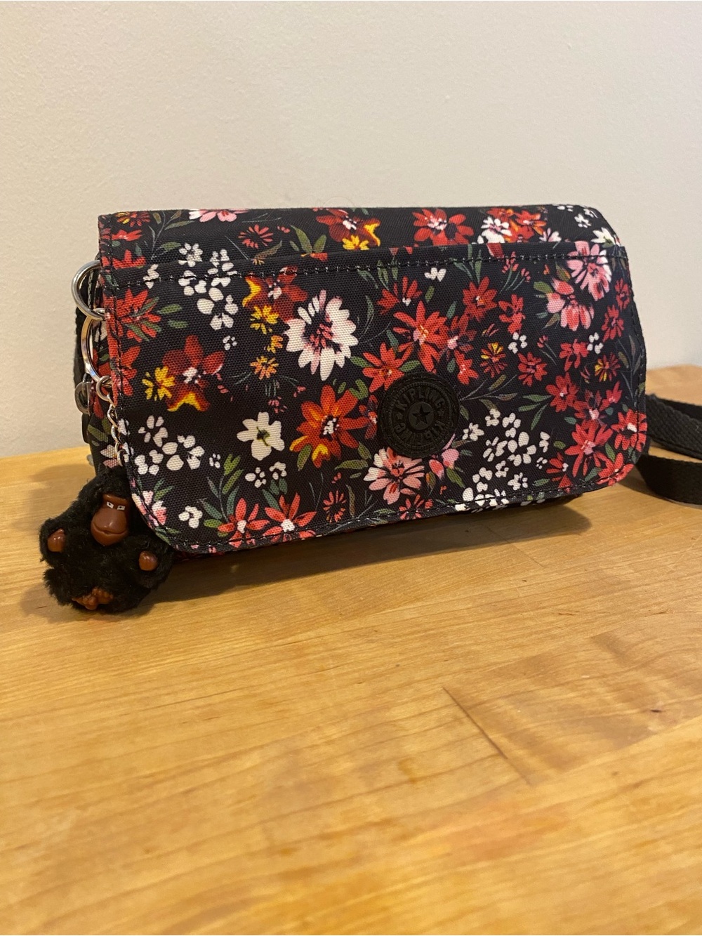 Kipling Black Floral Crossbody with Red, Pink & White Blooms